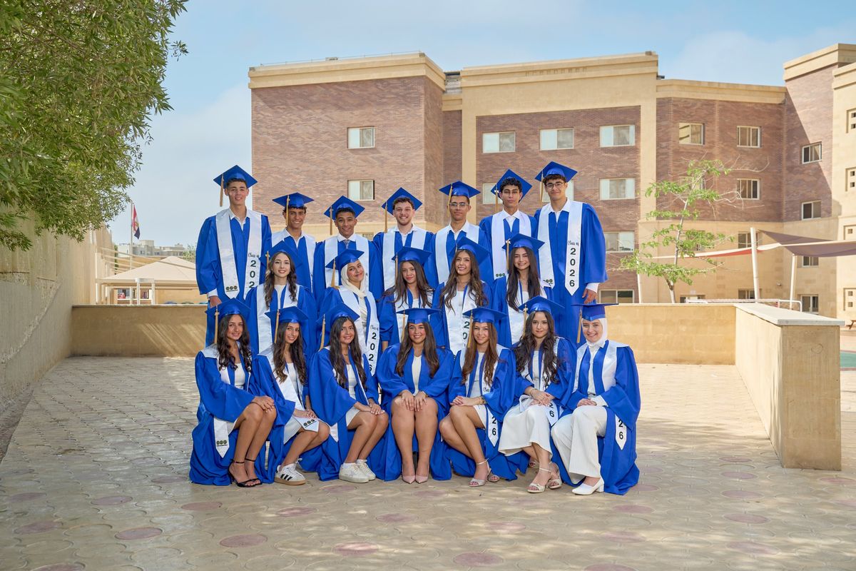 EVO Class of 2026 graduates in caps and gowns on campus
